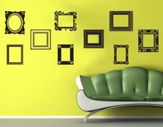 picture frames on wall with vintage couch